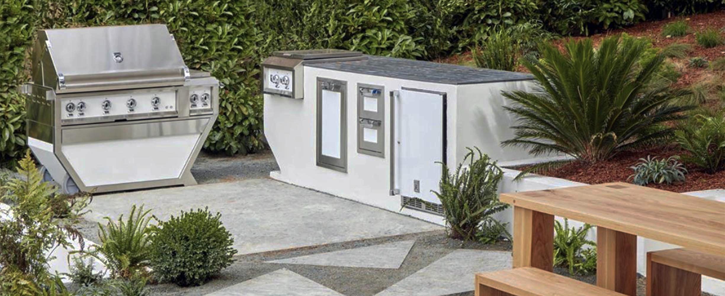 Landscapint patio in San Francisco, grill with table, fireplace with patio chairs.